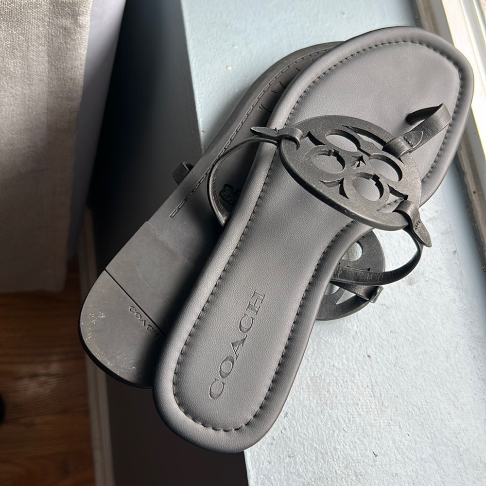 Coach black leather sandals.